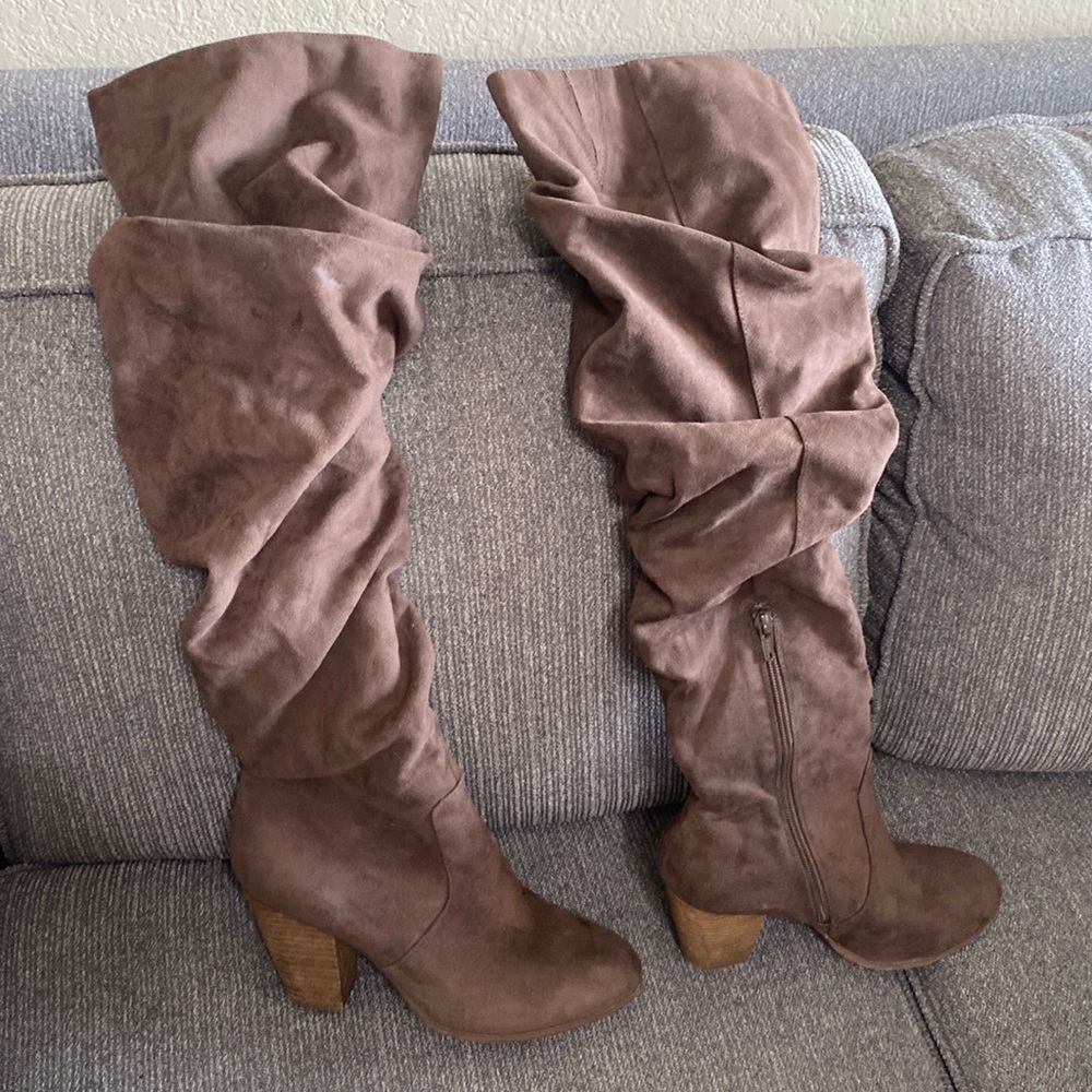 Absolutely cute over the knee boots. by Carlos Santana. scrunched up look.